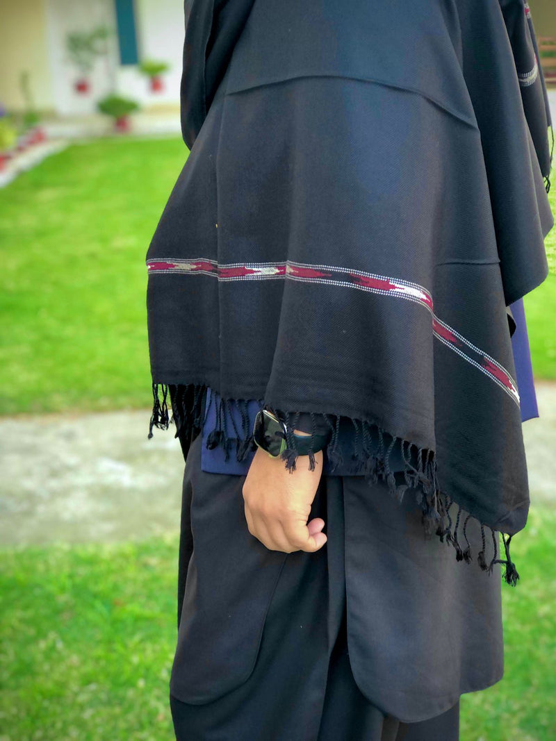 Our Pashmina black wool shawl is luxuriously crafted with a harmonious blend of fine wool and silk poly blend. It's lightweight and provides superior insulation so you'll always remain cozy without the worry of added bulk. Thi s timeless piece is idea.